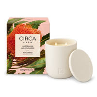 CIRCA Soy Candle Australian Wildflowers 300g in a cream ceramic vessel with lid beside native flower print gift box