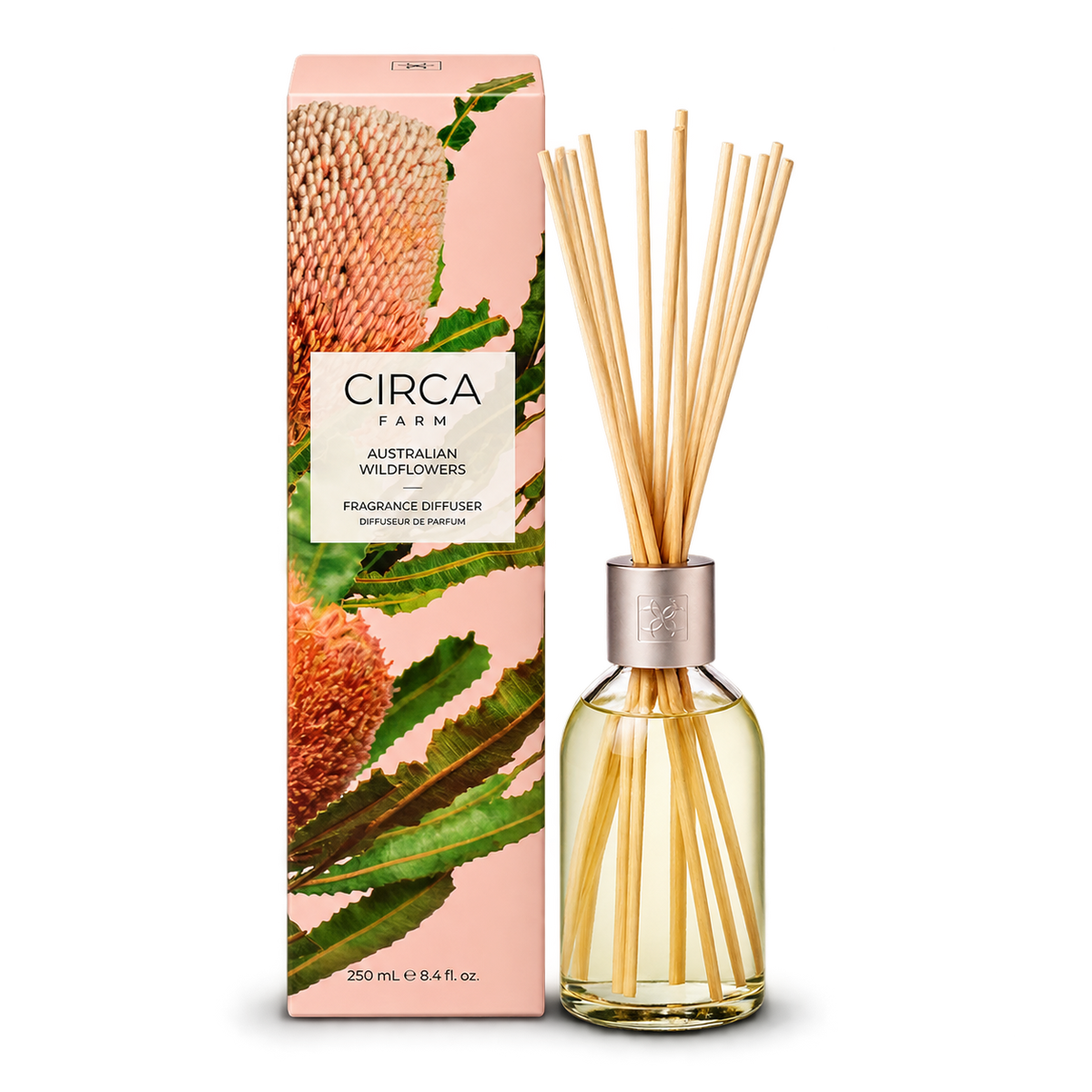 CIRCA Fragrance Diffuser Australian Wildflowers 250ml, glass reed diffuser bottle with reeds beside pink native flower print box