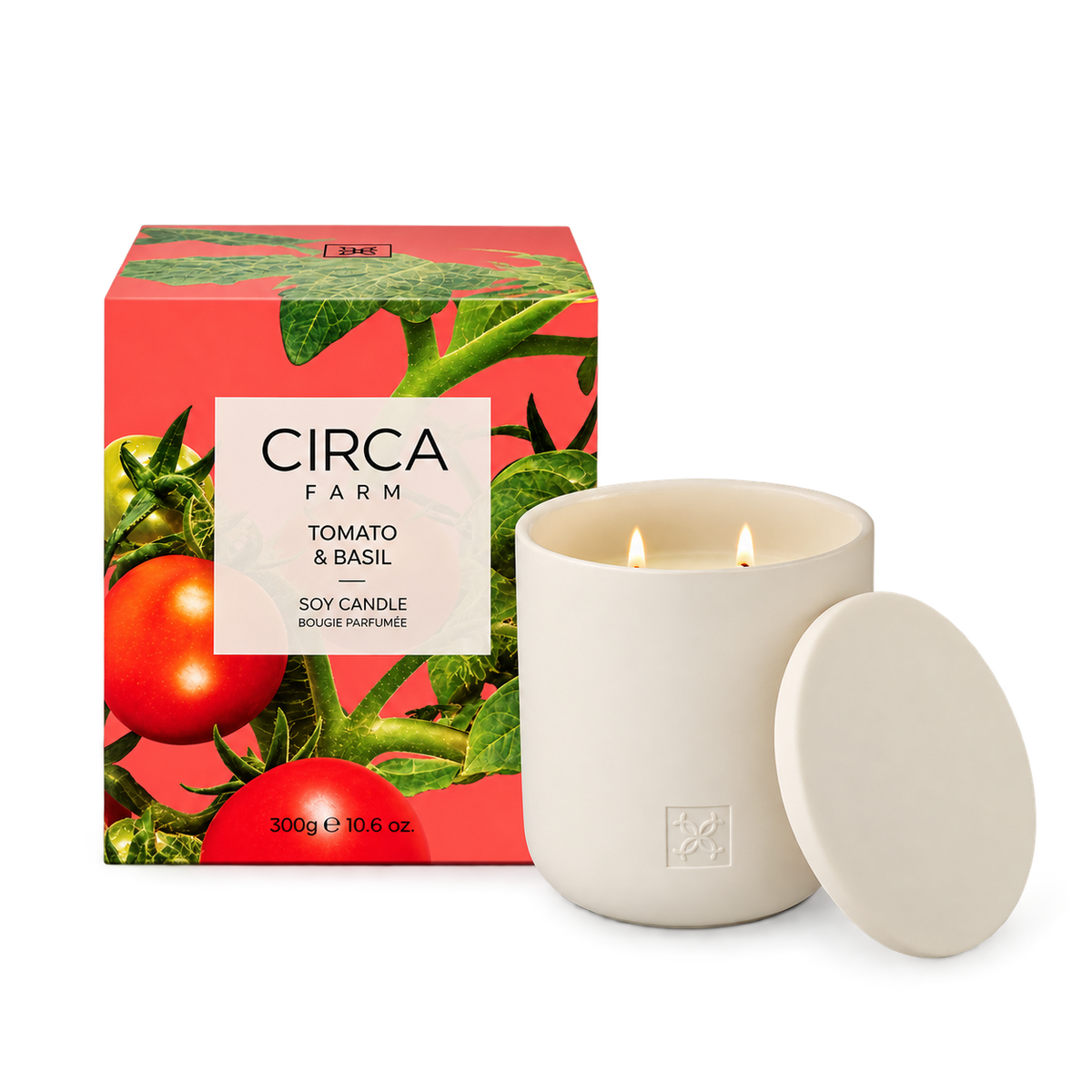 CIRCA Soy Candle Tomato and Basil 300g in a cream ceramic vessel with lid beside tomato vine print gift box