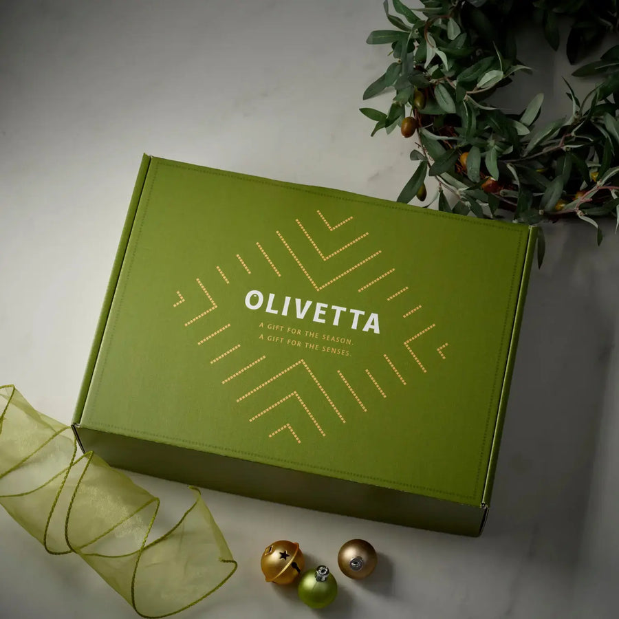 The Mediterranean Feast gift box from Olivetta, holding extra virgin olive oil, balsamic vinegar, a flavoured olive oil, tapenade, olives and capers.